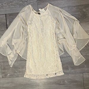 Sleeveless ivory dress with attached sheer cape. Size small